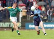 3 July 2004; Coman Goggins, Dublin, in action against John McGuinness, Leitrim. Bank of Ireland Football Championship Qualifier, Round 2, Leitrim v Dublin, O'Moore Park, Carrick-on-Shannon, Co. Leitrim. Picture credit; David Maher / SPORTSFILE