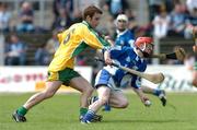 3 July 2004; James Hooban, Laois, in action against Travis Griffin, Donegal. All-Ireland U21 'B' Hurling Final, Laois v Donegal, O'Moore Park, Carrick-on-Shannon, Co. Leitrim. Picture credit; David Maher / SPORTSFILE