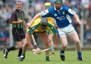 3 July 2004; Joy Boyle, Donegal, in action against Kieran Comerford,  Laois. All-Ireland U21 'B' Hurling Final, Laois v Donegal, O'Moore Park, Carrick-on-Shannon, Co. Leitrim. Picture credit; David Maher / SPORTSFILE