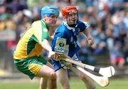3 July 2004; James Hooban, Laois, in action against Justin McGee, Donegal. All-Ireland U21 'B' Hurling Final, Laois v Donegal, O'Moore Park, Carrick-on-Shannon, Co. Leitrim. Picture credit; David Maher / SPORTSFILE