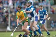 3 July 2004; Joy Boyle, Donegal, in action against John Walsh,  Laois. All-Ireland U21 'B' Hurling Final, Laois v Donegal, O'Moore Park, Carrick-on-Shannon, Co. Leitrim. Picture credit; David Maher / SPORTSFILE