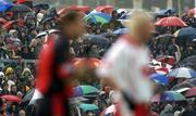 3 July 2004; Spectators watch the match in the rain. Bank of Ireland Football Championship Qualifier, Round 2, Down v Tyrone, Pairc an Iuir, Newry, Co. Down. Picture credit; Damien Eagers / SPORTSFILE