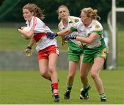 1 September 2013; Katy Holly, Derry, in action against Christine O'Donnell and Tresa McManus, Offaly. All-Ireland Ladies Football Junior Championship, Semi-Final, Offaly v Derry, Carrickmacross Emmets GAA Club, Emmet Park, Monaghan. Picture credit: Oliver McVeigh / SPORTSFILE