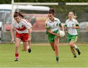 1 September 2013; Amy Kerrigan, Offaly, in action against Dania Donnelly, Derry. All-Ireland Ladies Football Junior Championship, Semi-Final, Offaly v Derry, Carrickmacross Emmets GAA Club, Emmet Park, Monaghan. Picture credit: Oliver McVeigh / SPORTSFILE