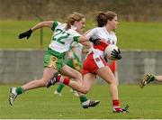 1 September 2013; Katy Holly, in action against Maeve Coleman. All-Ireland Ladies Football Junior Championship, Semi-Final, Offaly v Derry, Carrickmacross Emmets GAA Club, Emmet Park, Monaghan. Picture credit: Oliver McVeigh / SPORTSFILE
