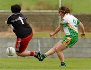 1 September 2013; Siobhan Flannery, Offaly,  scoring a goal against Briegeen Cassidy, Derry. All-Ireland Ladies Football Junior Championship, Semi-Final, Offaly v Derry, Carrickmacross Emmets GAA Club, Emmet Park, Monaghan. Picture credit: Oliver McVeigh / SPORTSFILE