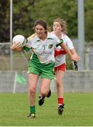 1 September 2013; Emma Dalton, Offaly, in action against Katy Holly, Derry. All-Ireland Ladies Football Junior Championship, Semi-Final, Offaly v Derry, Carrickmacross Emmets GAA Club, Emmet Park, Monaghan. Picture credit: Oliver McVeigh / SPORTSFILE