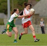 1 September 2013; Dania Donnelly, Derry, in action against Siobhan Flannery, Offaly. All-Ireland Ladies Football Junior Championship, Semi-Final, Offaly v Derry, Carrickmacross Emmets GAA Club, Emmet Park, Monaghan. Picture credit: Oliver McVeigh / SPORTSFILE
