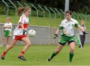 1 September 2013; Katy Holly, Derry, in action against Elaine Sullivan, Offaly. All-Ireland Ladies Football Junior Championship, Semi-Final, Offaly v Derry, Carrickmacross Emmets GAA Club, Emmet Park, Monaghan. Picture credit: Oliver McVeigh / SPORTSFILE