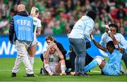 31 July 2023; Kyra Carusa of Republic of Ireland receieves medical attention after a collision with Nigeria goalkeeper Chiamaka Nnadozie during the FIFA Women's World Cup 2023 Group B match between Republic of Ireland and Nigeria at Brisbane Stadium in Brisbane, Australia. Photo by Stephen McCarthy/Sportsfile