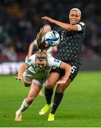 31 July 2023; Kyra Carusa of Republic of Ireland is tackled by Onome Ebi of Nigeria reacts during the FIFA Women's World Cup 2023 Group B match between Republic of Ireland and Nigeria at Brisbane Stadium in Brisbane, Australia. Photo by Mick O'Shea/Sportsfile