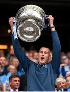 30 July 2023; Peadar Ó Cofaigh Byrne of Dublin lifts the Sam Maguire Cup after the GAA Football All-Ireland Senior Championship final match between Dublin and Kerry at Croke Park in Dublin. Photo by Ramsey Cardy/Sportsfile