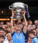 30 July 2023; Paul Mannion of Dublin lifts the Sam Maguire Cup after the GAA Football All-Ireland Senior Championship final match between Dublin and Kerry at Croke Park in Dublin. Photo by Ramsey Cardy/Sportsfile