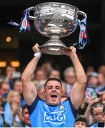30 July 2023; Brian Howard of Dublin lifts the Sam Maguire Cup after the GAA Football All-Ireland Senior Championship final match between Dublin and Kerry at Croke Park in Dublin. Photo by Ramsey Cardy/Sportsfile