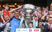 30 July 2023; Cormac Costello of Dublin lifts the Sam Maguire Cup after the GAA Football All-Ireland Senior Championship final match between Dublin and Kerry at Croke Park in Dublin. Photo by Ramsey Cardy/Sportsfile