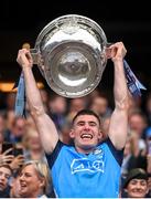 30 July 2023; Lee Gannon of Dublin lifts the Sam Maguire Cup after the GAA Football All-Ireland Senior Championship final match between Dublin and Kerry at Croke Park in Dublin. Photo by Ramsey Cardy/Sportsfile