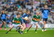 30 July 2023; Ben Crowe, St Mochta's NS, Clonsilla, Dublin, representing Dublin, in action against Daithí Byrne, St Ailbe's NS, Emly, Tipperary, representing Kerry,, left, and Billy McElholm, Knocknagor PS, Trillick, Tyrone, representing Kerry, during the INTO Cumann na mBunscol GAA Respect Exhibition Go Games at the GAA Football All-Ireland Senior Championship final match between Dublin and Kerry at Croke Park in Dublin. Photo by Ray McManus/Sportsfile