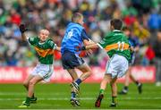 30 July 2023; Ben Crowe, St Mochta's NS, Clonsilla, Dublin, representing Dublin, is tackled by Billy McElholm, Knocknagor PS, Trillick, Tyrone, representing Kerry,left, and Daithí Byrne, St Ailbe's NS, Emly, Tipperary, representing Kerry, during the INTO Cumann na mBunscol GAA Respect Exhibition Go Games at the GAA Football All-Ireland Senior Championship final match between Dublin and Kerry at Croke Park in Dublin. Photo by Ray McManus/Sportsfile