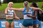 30 July 2023; Sarah Lavin of Emerald AC, Limerick, left, is congratulated by Sive O'Toole of St Laurence O'Toole AC, Carlow, centre, and Cressida Amaniampong of Skerries AC, Dubin, after winning the women's 100m during day two of the 123.ie National Senior Outdoor Championships at Morton Stadium in Dublin. Photo by Sam Barnes/Sportsfile