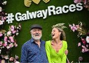 31 July 2023; Racegoer Gabrielle Dunne from Oranmore, Galway and Tim Cronin from Cork during day one of the Galway Races Summer Festival at Ballybrit Racecourse in Galway. Photo by David Fitzgerald/Sportsfile