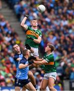 30 July 2023; Diarmuid O'Connor of Kerry supported by Gavin White punches the ball clear of Dublin pair Brian Fenton and Con O'Callaghan during the GAA Football All-Ireland Senior Championship final match between Dublin and Kerry at Croke Park in Dublin. Photo by Ray McManus/Sportsfile