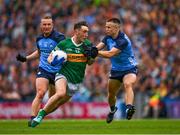 30 July 2023; Paudie Clifford of Kerry is tackled by Eoin Murchan supported by Ciaran Kilkenny during the GAA Football All-Ireland Senior Championship final match between Dublin and Kerry at Croke Park in Dublin. Photo by Ray McManus/Sportsfile
