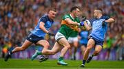30 July 2023; Paudie Clifford of Kerry slips between Eoin Murchan and Ciaran Kilkenny of Dublin, left, during the GAA Football All-Ireland Senior Championship final match between Dublin and Kerry at Croke Park in Dublin. Photo by Ray McManus/Sportsfile