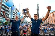 31 July 2023; Dean Rock, left, and James McCarthy of Dublin with the Sam Maguire cup during the homecoming celebrations of the Dublin All-Ireland Football Champions at Smithfield Square in Dublin. Photo by Ramsey Cardy/Sportsfile