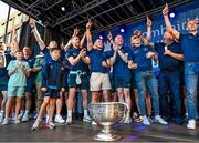 31 July 2023; Dublin players celebrate during the homecoming celebrations of the Dublin All-Ireland Football Champions at Smithfield Square in Dublin. Photo by Ramsey Cardy/Sportsfile