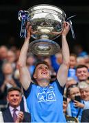 30 July 2023; Daire Newcombe of Dublin lifts the Sam Maguire Cup after his side's victory in the GAA Football All-Ireland Senior Championship final match between Dublin and Kerry at Croke Park in Dublin. Photo by Seb Daly/Sportsfile