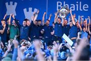 31 July 2023; Captain James McCarthy, left, and manager Dessie Farrell lift the Sam Maguire cup during the homecoming celebrations of the Dublin All-Ireland Football Champions at Smithfield Square in Dublin. Photo by Ramsey Cardy/Sportsfile