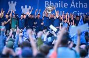 31 July 2023; Captain James McCarthy, left, and manager Dessie Farrell lift the Sam Maguire cup during the homecoming celebrations of the Dublin All-Ireland Football Champions at Smithfield Square in Dublin. Photo by Ramsey Cardy/Sportsfile