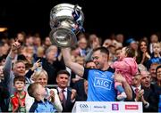 30 July 2023; Dean Rock of Dublin lifts the Sam Maguire Cup with his daughter Sadie after his side's victory in the GAA Football All-Ireland Senior Championship final match between Dublin and Kerry at Croke Park in Dublin. Photo by Seb Daly/Sportsfile