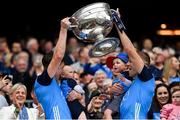 30 July 2023; Dublin players Michael Fitzsimons, left, and Paul Mannion lift the Sam Maguire Cup after their side's victory in the GAA Football All-Ireland Senior Championship final match between Dublin and Kerry at Croke Park in Dublin. Photo by Seb Daly/Sportsfile