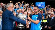 30 July 2023; Dublin captain James McCarthy is congratulated by Uachtarán Chumann Lúthchleas Gael Larry McCarthy as he presents him with the Sam Maguire Cup after the GAA Football All-Ireland Senior Championship final match between Dublin and Kerry at Croke Park in Dublin. Photo by Ray McManus/Sportsfile