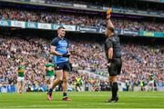 30 July 2023; Referee David Gough shows a yellow card to Lee Gannon of Dublin  during the GAA Football All-Ireland Senior Championship final match between Dublin and Kerry at Croke Park in Dublin. Photo by Seb Daly/Sportsfile