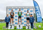 30 July 2023; Men's 400m hurdles medallists Thomas Barr of Ferrybank AC, Waterford, gold, centre, Thomas Anthony Pitkin of Clonliffe Harriers AC, Dublin, silver, left, and Ciaran Nugent of Carraig-Na-Bhfear AC, Cork, bronze, right, with Athletic's Ireland Competition Committee Member Patricia Griffin, far left, and Athletics Ireland board member Brid Golden, far right, during day two of the 123.ie National Senior Outdoor Championships at Morton Stadium in Dublin. Photo by Sam Barnes/Sportsfile