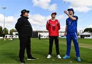 1 August 2023; Leinster Lightning captain George Dockrell, right, makes the toss watched by Munster Reds captain Peter Moor and third umpire Willie Clarke before the Rario Inter-Provincial Trophy 2023 match between Leinster Lightning and Munster Reds at Pembroke Cricket Club in Dublin. Photo by Sam Barnes/Sportsfile