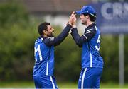 1 August 2023; George Dockrell of Leinster Lightning, right, celebrates with team-mate Simi Singh after catching out Cian Egerton of Munster Reds during the Rario Inter-Provincial Trophy 2023 match between Leinster Lightning and Munster Reds at Pembroke Cricket Club in Dublin. Photo by Sam Barnes/Sportsfile