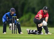 1 August 2023; Liam McCarthy of Munster Reds bats watched by Leinster Lightning wicketkeeper Mark Donegan during the Rario Inter-Provincial Trophy 2023 match between Leinster Lightning and Munster Reds at Pembroke Cricket Club in Dublin. Photo by Sam Barnes/Sportsfile