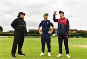 1 August 2023; Northern Knights captain Neil Rock, right, makes the toss watched by North West Warriors captain Andy McBrine and Third Umpire Willie Clarke before the Rario Inter-Provincial Trophy 2023 match between Northern Knights and North West Warriors at Pembroke Cricket Club in Dublin. Photo by Sam Barnes/Sportsfile