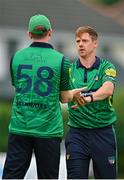 1 August 2023; Craig Young of North West Warriors, right, and team-mate Shane Getkate celebrate the wicket of Paul Stirling of Northern Knights during the Rario Inter-Provincial Trophy 2023 match between Northern Knights and North West Warriors at Pembroke Cricket Club in Dublin. Photo by Sam Barnes/Sportsfile