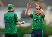 1 August 2023; Craig Young of North West Warriors, right, and team-mate Shane Getkate celebrate the wicket of Paul Stirling of Northern Knights during the Rario Inter-Provincial Trophy 2023 match between Northern Knights and North West Warriors at Pembroke Cricket Club in Dublin. Photo by Sam Barnes/Sportsfile