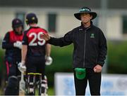 1 August 2023; Umpire Aidan Seaver signals a four during the Rario Inter-Provincial Trophy 2023 match between Northern Knights and North West Warriors at Pembroke Cricket Club in Dublin. Photo by Sam Barnes/Sportsfile