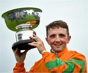 1 August 2023; Jockey Chris Hayes with the trophy after winning the Colm Quinn BMW Mile Handicap during day two of the Galway Races Summer Festival 2023 at Galway Racecourse in Ballybrit, Galway. Photo by David Fitzgerald/Sportsfile