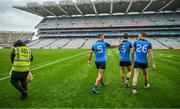 30 July 2023; Dublin players, from left, James McCarthy, Michael Fitzsimons and Dean Rock walk out to the middle of the pitch following the celebrations of their victory in the GAA Football All-Ireland Senior Championship final match between Dublin and Kerry at Croke Park in Dublin. Photo by Brendan Moran/Sportsfile