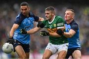 30 July 2023; Graham O'Sullivan of Kerry is tackled by James McCarthy, left, and Ciaran Kilkenny of Dublin during the GAA Football All-Ireland Senior Championship final match between Dublin and Kerry at Croke Park in Dublin. Photo by Brendan Moran/Sportsfile