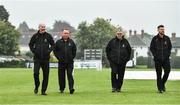 2 August 2023; Officials, from left, umpire Jonathan Kennedy, umpire Jareth McCready, match referee Phil Thompson, and third umpire Gareth Morrison conduct a pitch inspection before abandoning the Rario Inter-Provincial Trophy 2023 match between Munster Reds and Northern Knights at Pembroke Cricket Club in Dublin. Photo by Sam Barnes/Sportsfile