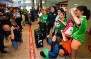 2 August 2023; Niamh Fahey and supporters pose for photographers at Dublin Airport on the Republic of Ireland's return from the FIFA Women's World Cup 2023 in Australia. Photo by Stephen McCarthy/Sportsfile