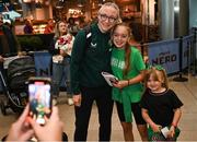 2 August 2023; Louise Quinn poses for a photo with Megan, age 12, and Pixie O'Neill, age 6, from Dublin at Dublin Airport on the Republic of Ireland's return from the FIFA Women's World Cup 2023 in Australia. Photo by David Fitzgerald/Sportsfile